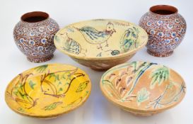 A pair of continental pedestal vases decorated with enamels in the Persian style, 20cm tall together