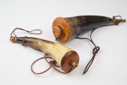 Two American civil war type horn powder flasks with wooden and metal fittings and leather slings,