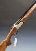 Kral Arms Tundra Trap 12 bore over and under ejector shotgun with chequered semi-pistol grip and