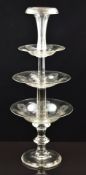 A near pair of clear cut glass three tier fruit stands, each with etched decoration, 65cm tall.