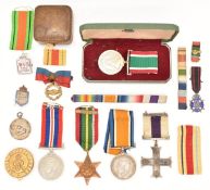 British Military Cross Medal unnamed as issued together with a WW1 War Medal named to 2nd Lieutenant