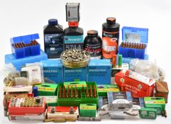 A large collection of shotgun and rifle ammunition, empty cases for reloading, primers, smokeless