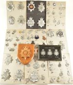 Collection of seventy four police helmet badges and cap badges including West Yorkshire, Merseyside,