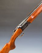 Miroku 12 bore over and under ejector shotgun with engraved locks and underside, chequered semi-
