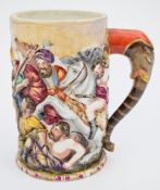 19thC Capodimonte / Naples relief moulded tankard decorated with a battle scene / lions, with