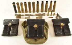 A small collection of gun and shooting related items comprising two Colt .45 leather magazine