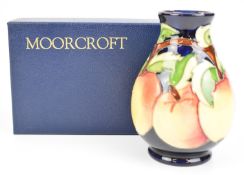 Moorcroft pedestal vase decorated with apples, height 14.5cm