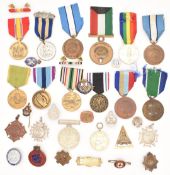 Approximately thirty medals and badges including United States of America for Humanitarian Services,