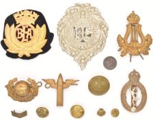 Five military interest badges including Bandsman's arm badge, Royal Marines together with a gilt