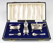 Elizabeth II hallmarked silver silver three piece cruet set with blue glass liners, Birmingham 1959,