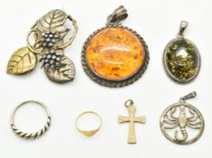 A 9ct gold cross, 9ct gold ring (1.1g), silver brooch in a foliate design, two silver pendants set