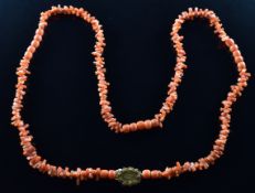 A beaded 19thC coral necklace with yellow metal clasp