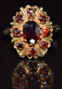 A 9ct gold ring set with garnets, 3.5g, size N