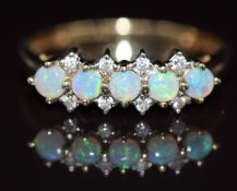 A 9ct gold ring set with five opals and diamonds, 1.9g, size O