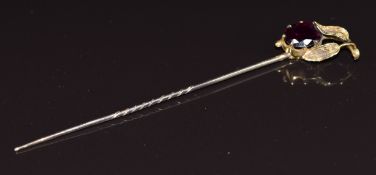 Victorian stick pin set with an oval cut garnet with foliate decoration, 2.2g, in vintage box