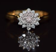 An 18ct gold ring set with diamonds in a cluster, 3.2g, size P
