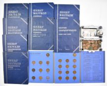 A collection of UK pennies, halfpennies, farthings and threepenny pieces, most contained in