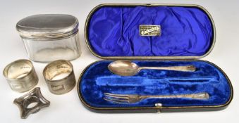 Hallmarked silver spoon, fork, two napkin rings and candlestick sconce, together with a hallmarked