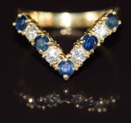 An 18ct gold V shape ring set with sapphires and diamonds, 3.6g, size M