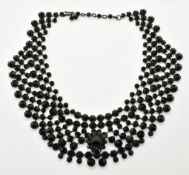A 19thC French jet collar necklace stamped 'made in Austria'