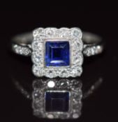Art Deco 18ct white gold ring set with a square cut sapphire surrounded by diamonds, 2.3g, size N