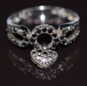 A 9k white gold ring set with black diamonds, 2.8g, size L