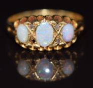 Edwardian 18ct gold ring set with three opal cabochons and diamonds (one diamond missing), Chester