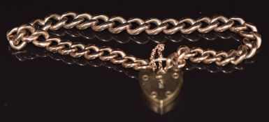 A 9ct rose gold curb link bracelet with heart padlock clasp, 18.8g
