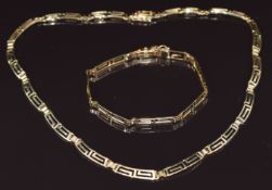 A 14k gold Greek key necklace and matching bracelet, 23g