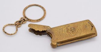 W Avery & Son, Redditch 'Quadruple' needle case and an ornate knotted magnifier