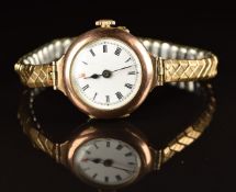 Unnamed 9ct gold ladies wristwatch with blued hands, black Roman numerals, white dial and unsigned