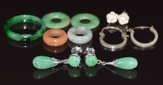 A pair of 9ct white gold earrings set with jade, a jade ring, four jadeite discs and two pairs of