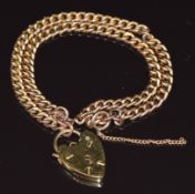 A 9ct gold double strand curb link bracelet, originally a fob chain, with heart padlock clasp, 25.