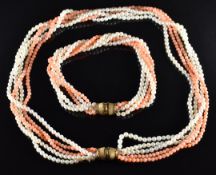 A coral and pearl multi strand necklace with 9ct gold clasp by JKa, with matching bracelet
