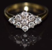 An 18ct gold ring set with nine diamonds, each approximately 0.1ct, in a cluster, 4.9g, size Q