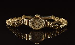 Regency 9ct gold ladies wristwatch with gold hands, two-tone hour markers, silver dial and 17