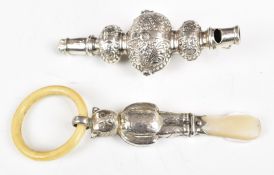 Two hallmarked silver baby's rattles, one formed as a teddy bear, with mother of pearl handle the