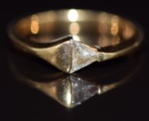 An 18ct gold ring set with a trilliant cut diamond of approximately 0.2ct, 3.7g, size M