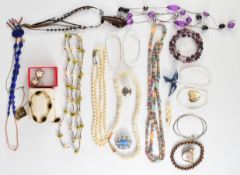 A collection of costume jewellery including mother of pearl earrings, gold plated bracelet, lapis