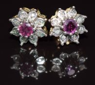 A pair of 9ct gold earrings each set with a ruby and diamonds, 1.6g