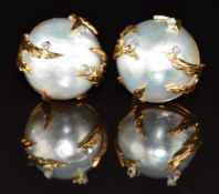 A pair of 18ct gold earrings set with mabé pearls and diamonds in a foliate textured setting, 27.7g