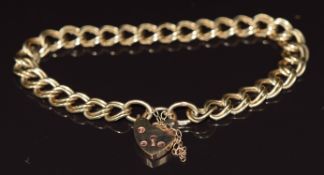 A 9ct gold double curb link bracelet with heart padlock clasp, 13.9g