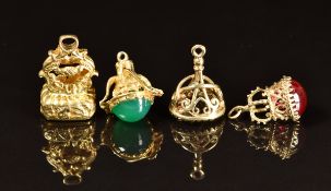 Four 9ct gold charms / seals set with onyx, smoky quartz, green agate and synthetic ruby, 21.7g
