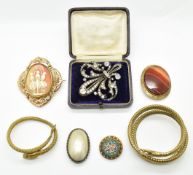 Two Art Deco snake bangles, paste buckle, Victorian swivel brooch set with a cameo and a