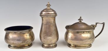 Hallmarked silver three piece cruet set, the mustard and salt having blue glass liners, Sheffield
