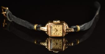 Avia 9ct gold ladies wristwatch with gold hands, Arabic numerals and hour markers, silver dial and