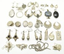Thirteen silver pairs of earrings, and fourteen necklaces / pendants including one set with lapis
