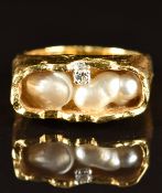 An 18ct gold ring set with two blister pearls and a diamond, maker S.L.W, 12.1g, size L