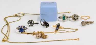 A collection of jewellery including 14k gold wishbone ring (0.6g), a 9ct gold cross on chain (0.7g),