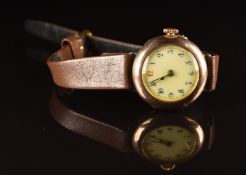 Unnamed 9ct gold ladies wristwatch with blued hands, blue Arabic numerals, gilt decorated white